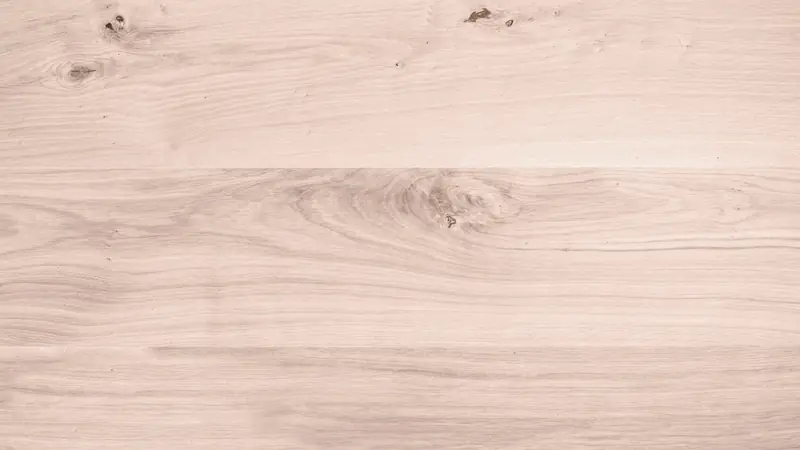 Planches de bois clair à nœuds et veinage apparent, vues de dessus